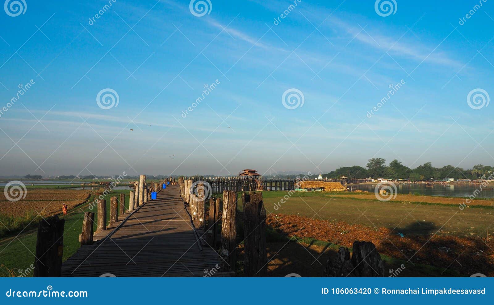 sunset in u bein bridge with vintage boat myanmar. u bein bridge is longest teak