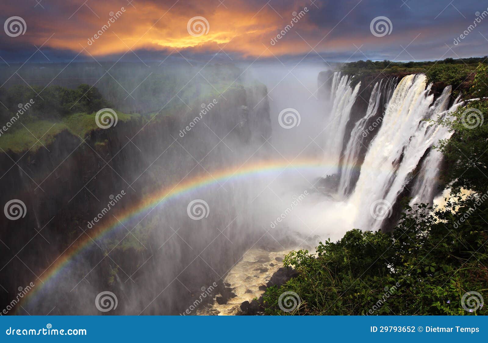 victoria falls sunset with rainbow, zambia