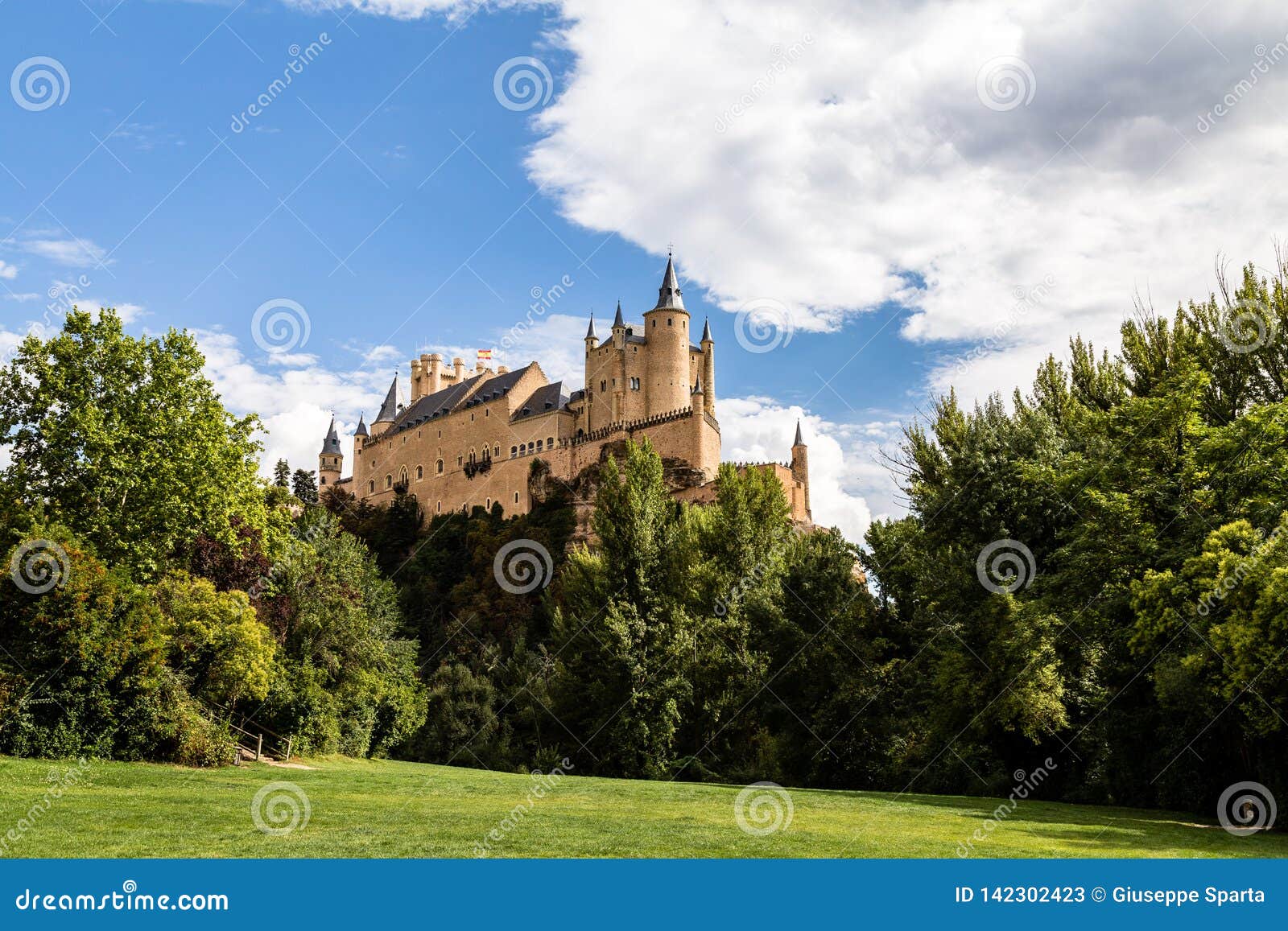the famous view of the alcazar of segovia in a sunny summer day from the view point of la pradera de san marcos, segovia, spain