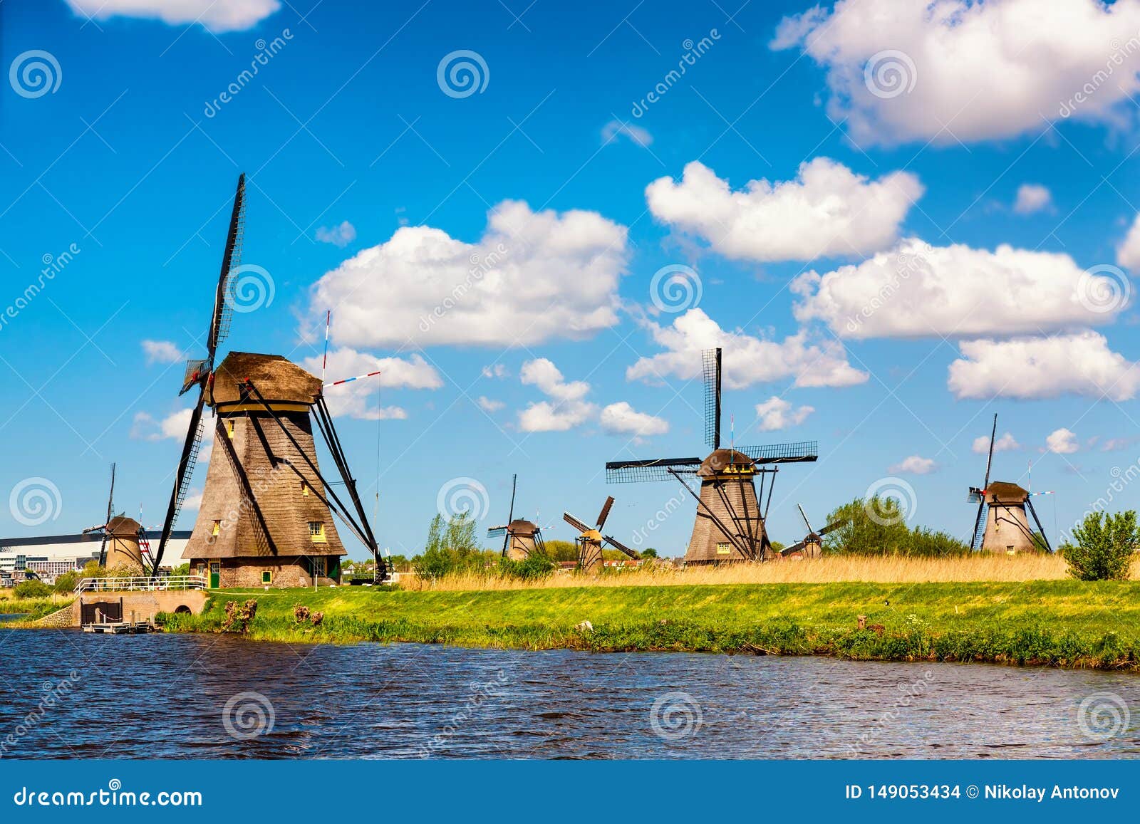famous windmills in kinderdijk village in holland. colorful spring rural landscape in netherlands, europe. unesco world heritage