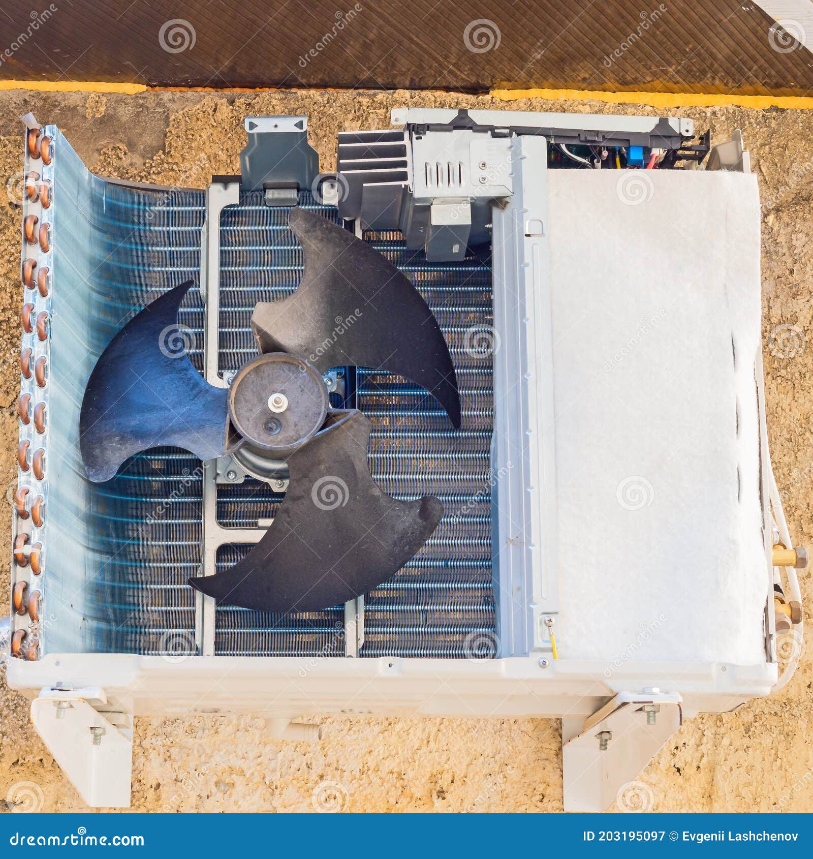 Fan in the Compressor Installation of an Air Conditioner Hanging from
