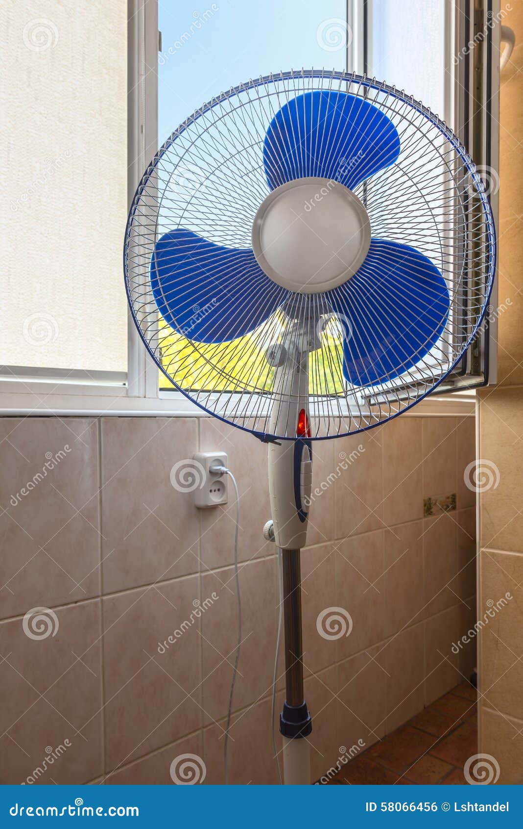 Fan near an open window stock photo. Image of supercharger 58066456