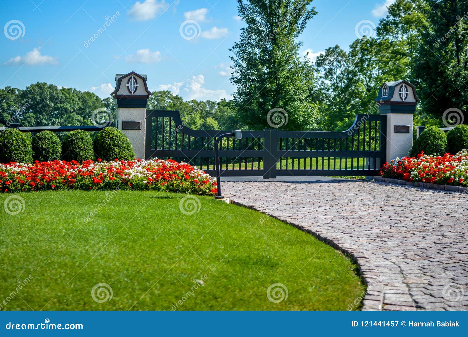 fancy gated entrance brick driveway