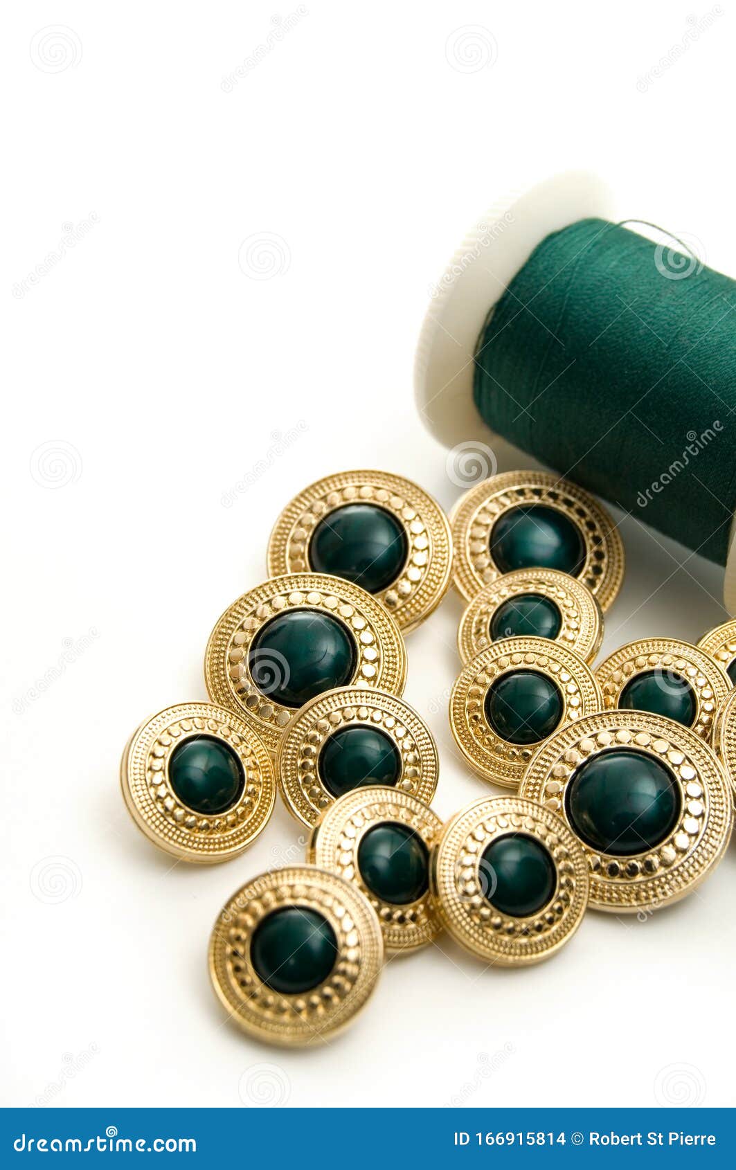 Fancy Green and Gold Sewing Buttons with Green Thread Stock Photo