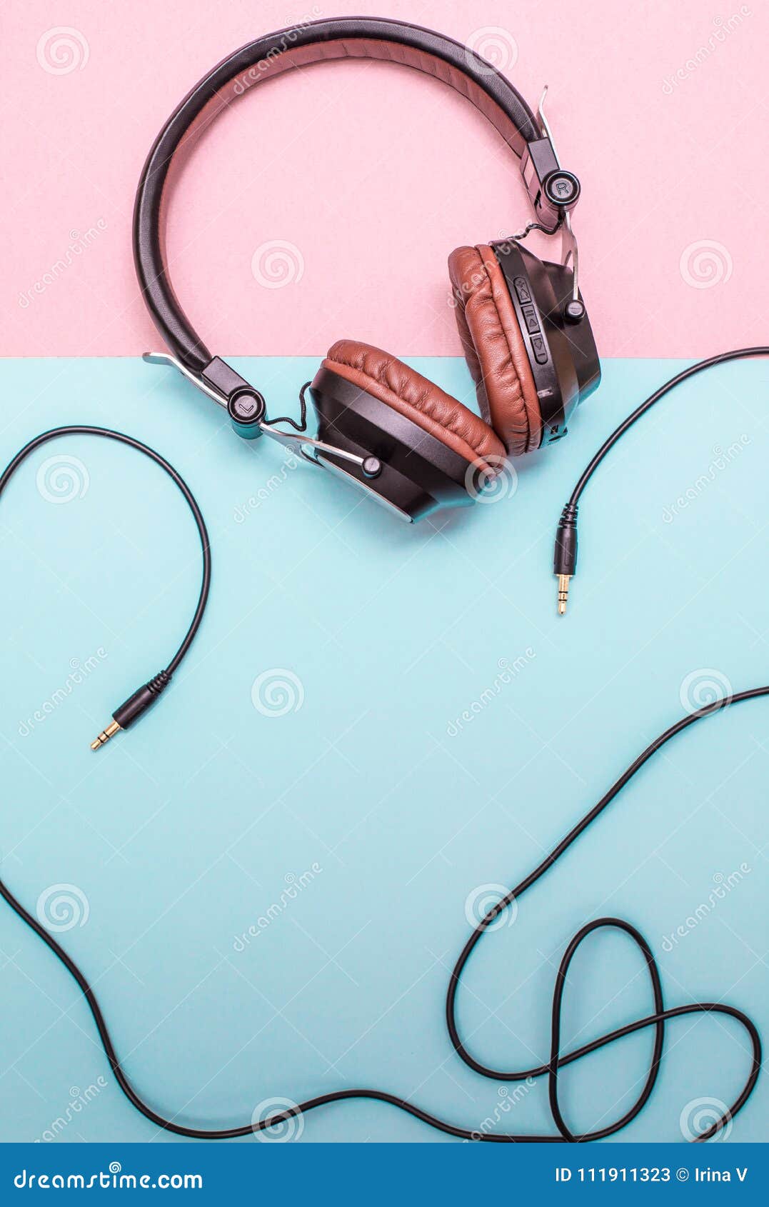 Fancy Headphones Laying On A Flat Pink And Blue Surface. Analog Wire