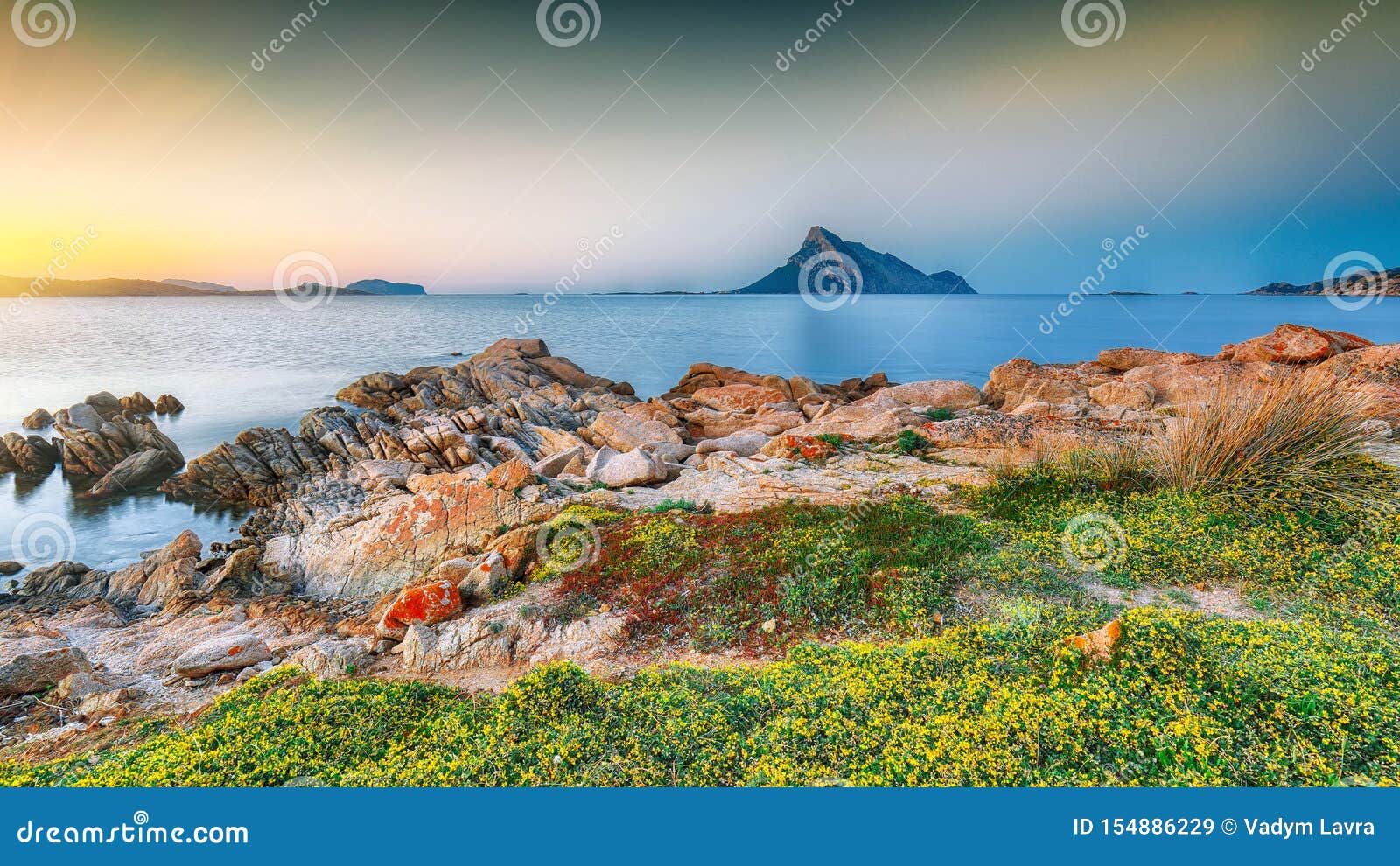 fantastic azure water with rocks near beach porto taverna at sunset