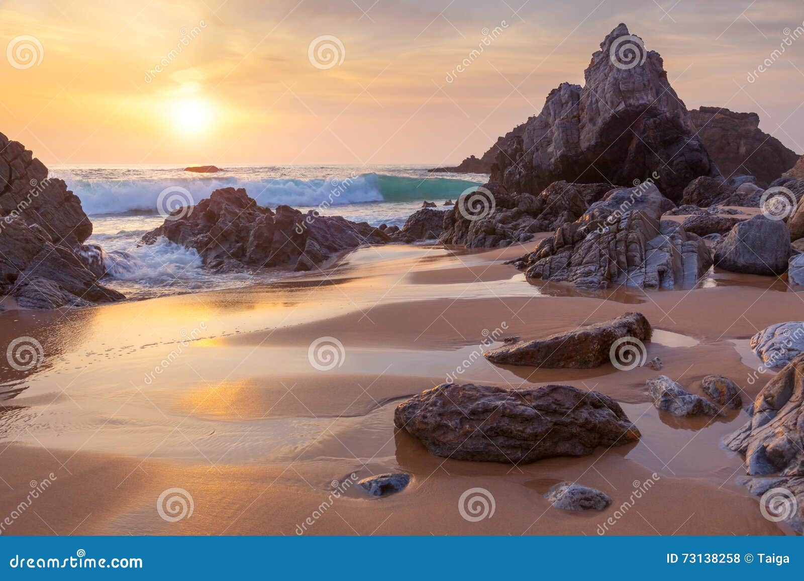 fantastic big rocks and ocean waves at golden sundown