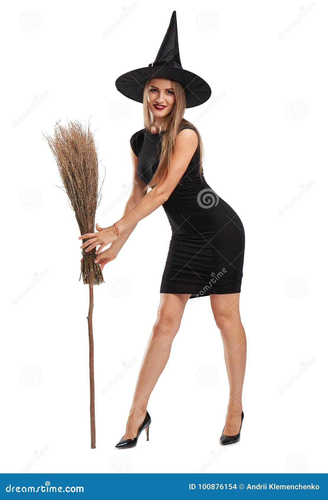 Attractive Witch Girl With A Broom Isolated On A White