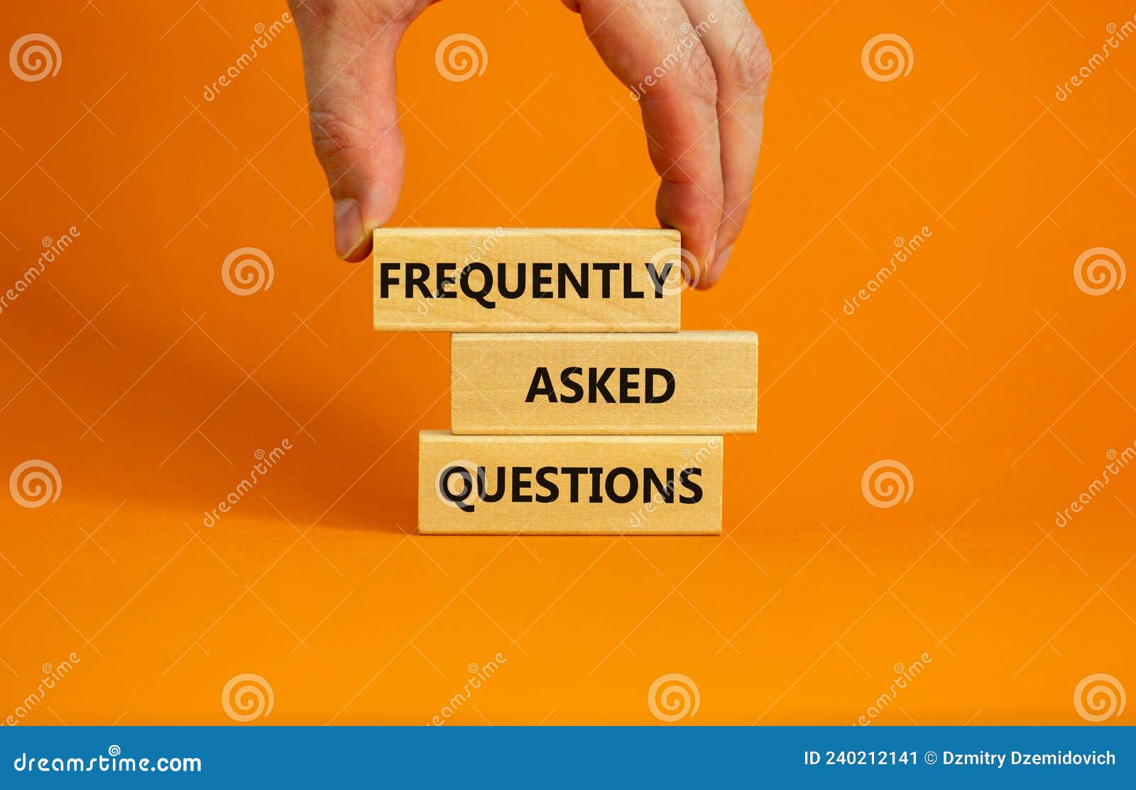 faq frequently asked questions . concept words faq frequently asked questions on blocks on beautiful orange table orange