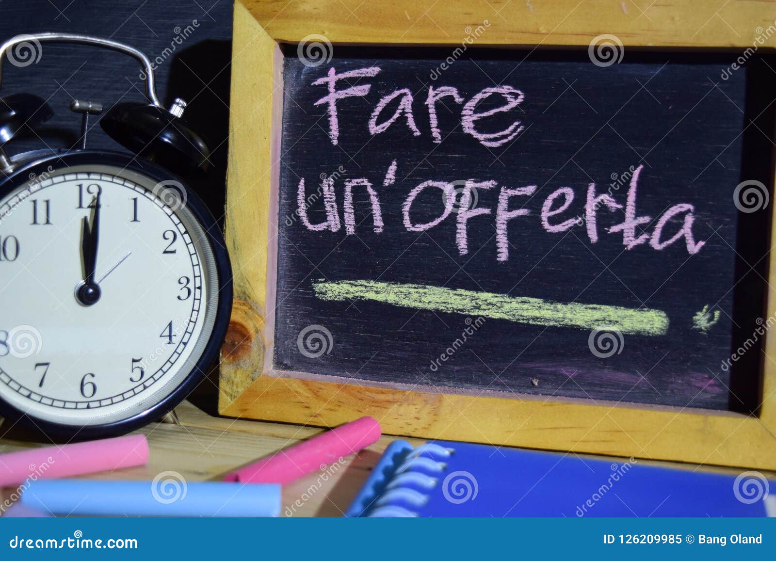 fare un`offerta in italian on phrase colorful handwritten on blackboard.