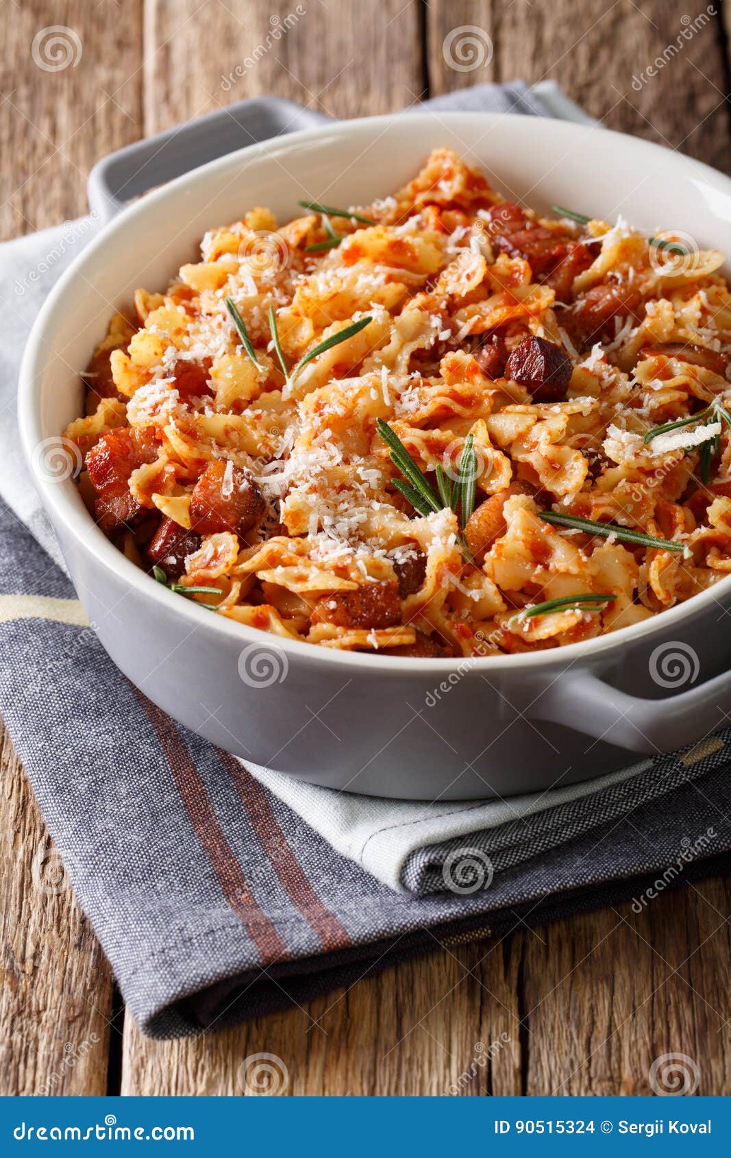 Farfaline Pasta with Tomato, Bacon and Parmesan Close-up in a Sa Stock ...