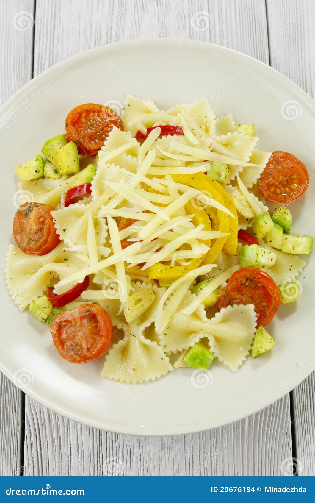 Farfalle with Zucchini, Tomatoes and Cheese Stock Photo - Image of ...