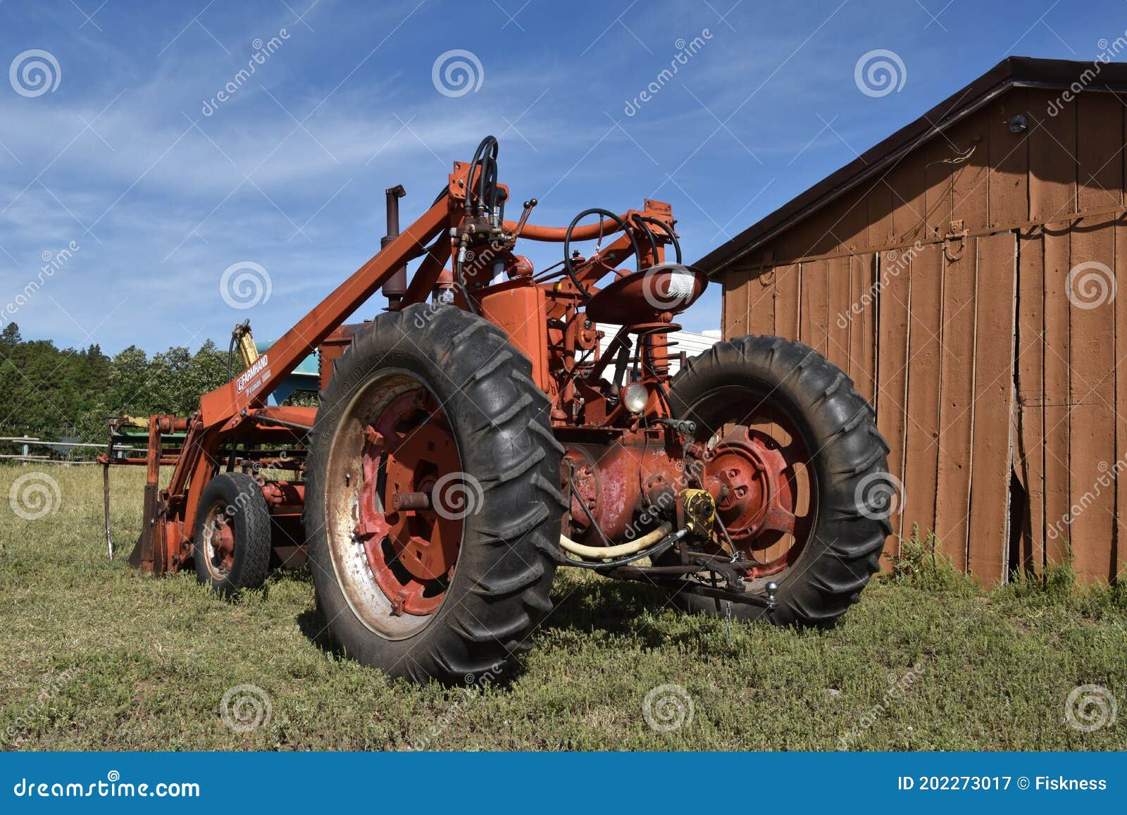 Farm M Tractor with a Farmhand Front End Loader Editorial Photography