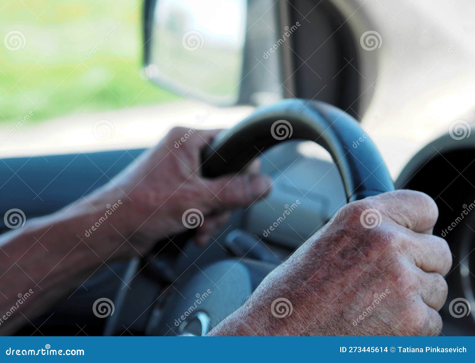 Farmer Driving in the Freeway. Hands on the Steering Wheel. Stock Photo