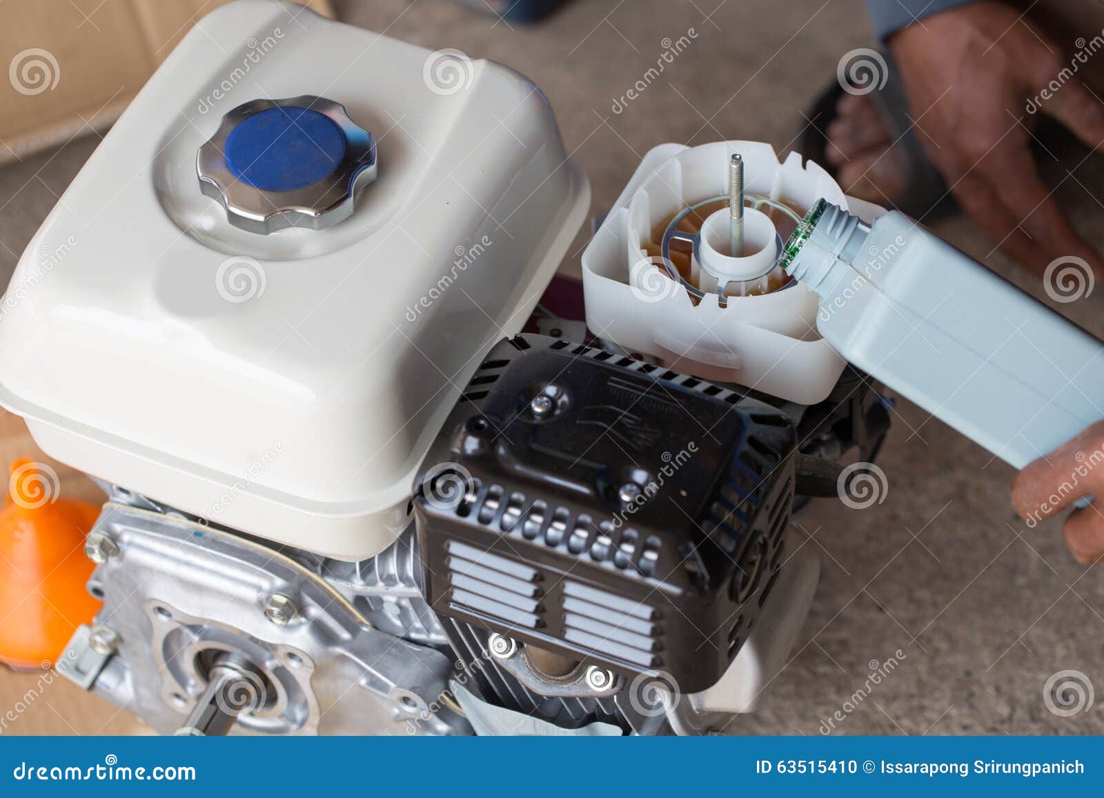 Farmer Fill Engine Oil into Oil Filter of Water Pump Stock Photo