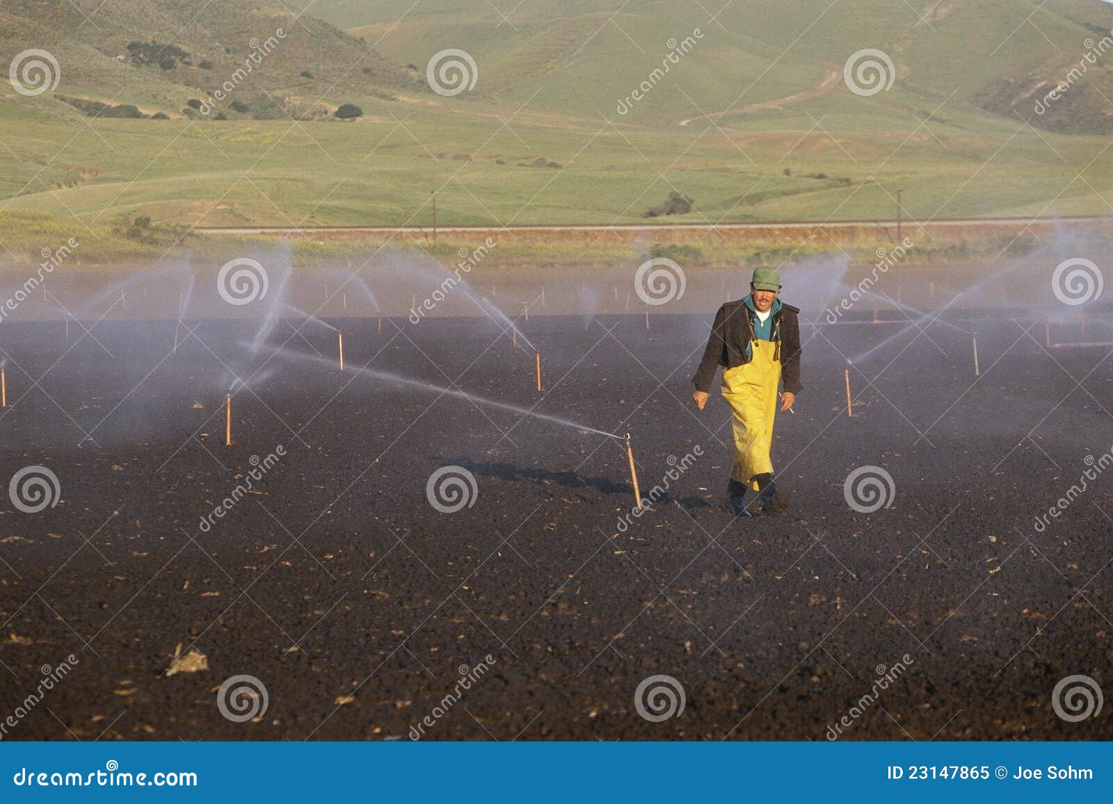 Farmer in irrigation field editorial image. Image of individual 23147865