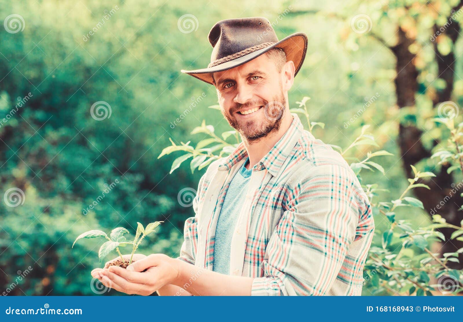 Farming and Agriculture Cultivation. Gardening. Muscular Ranch Man in ...