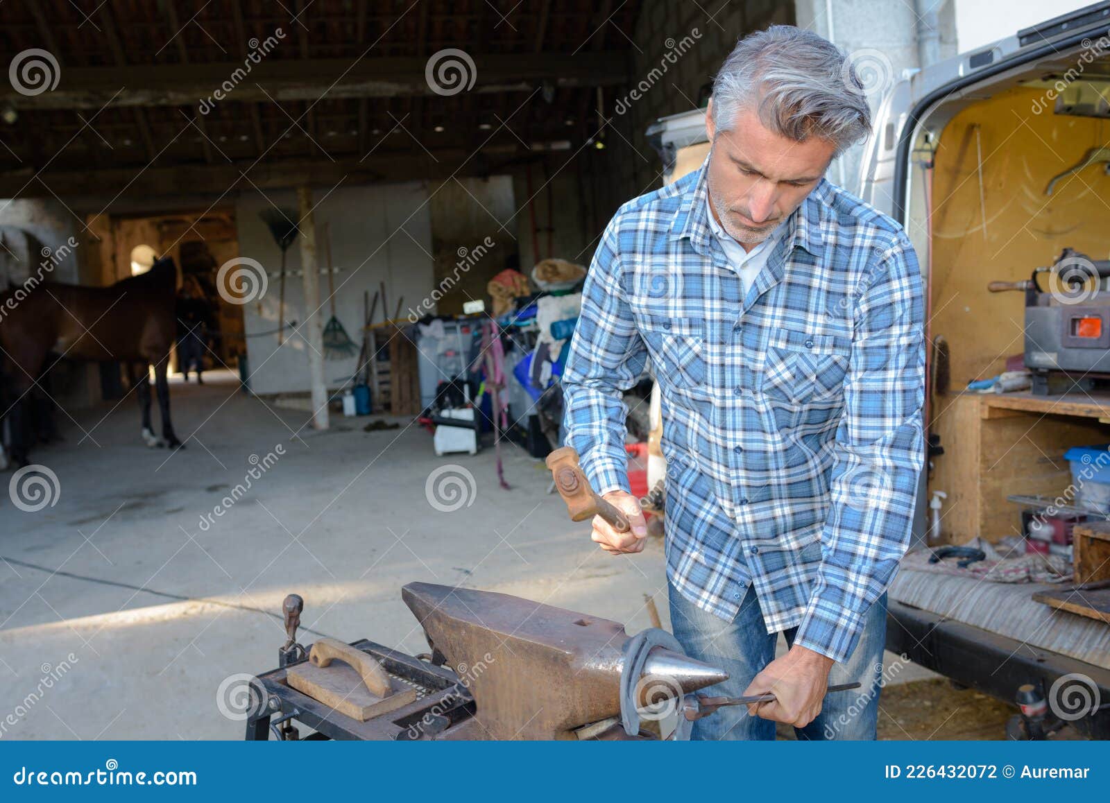 Farrier shaping hot shoe stock photo. Image of craft 226432072