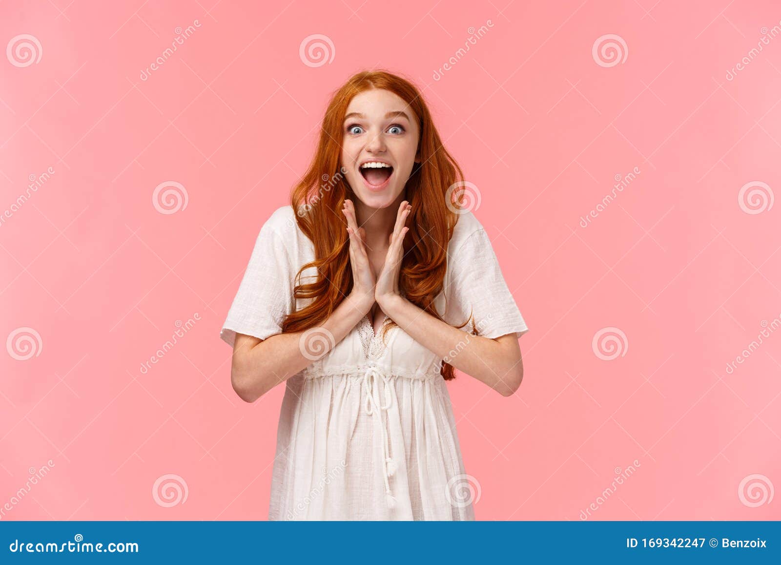 Fascinated Amused Lucky Redhead Female In White Dress Clap Hands Applause From Excitement And