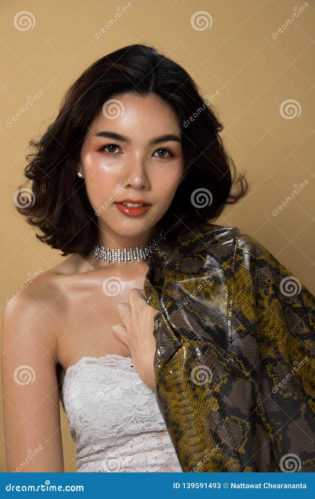 Fashion Asian Woman Tan Skin Black Hair Eyes Stock Image