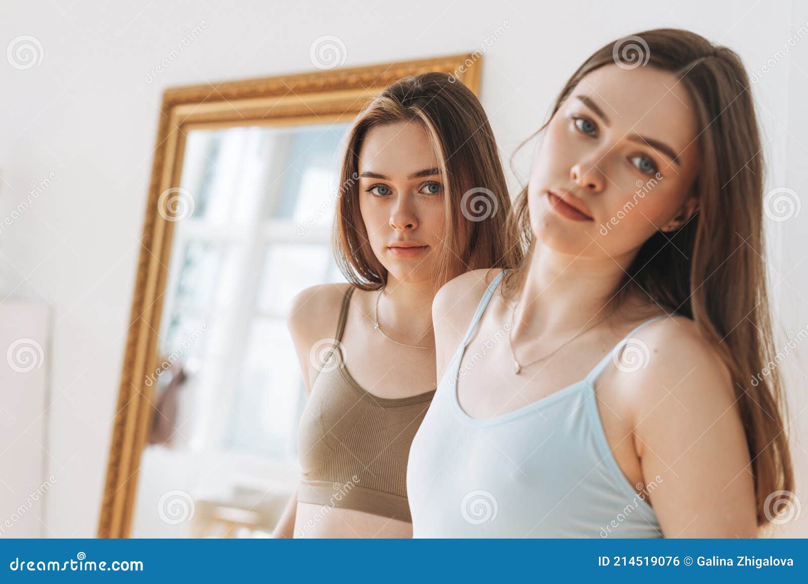 Fashion beauty models two sisters twins beautiful girls with long hair in  sport seamless ribbed underwear in the bright studio 16799305 Stock Photo  at Vecteezy