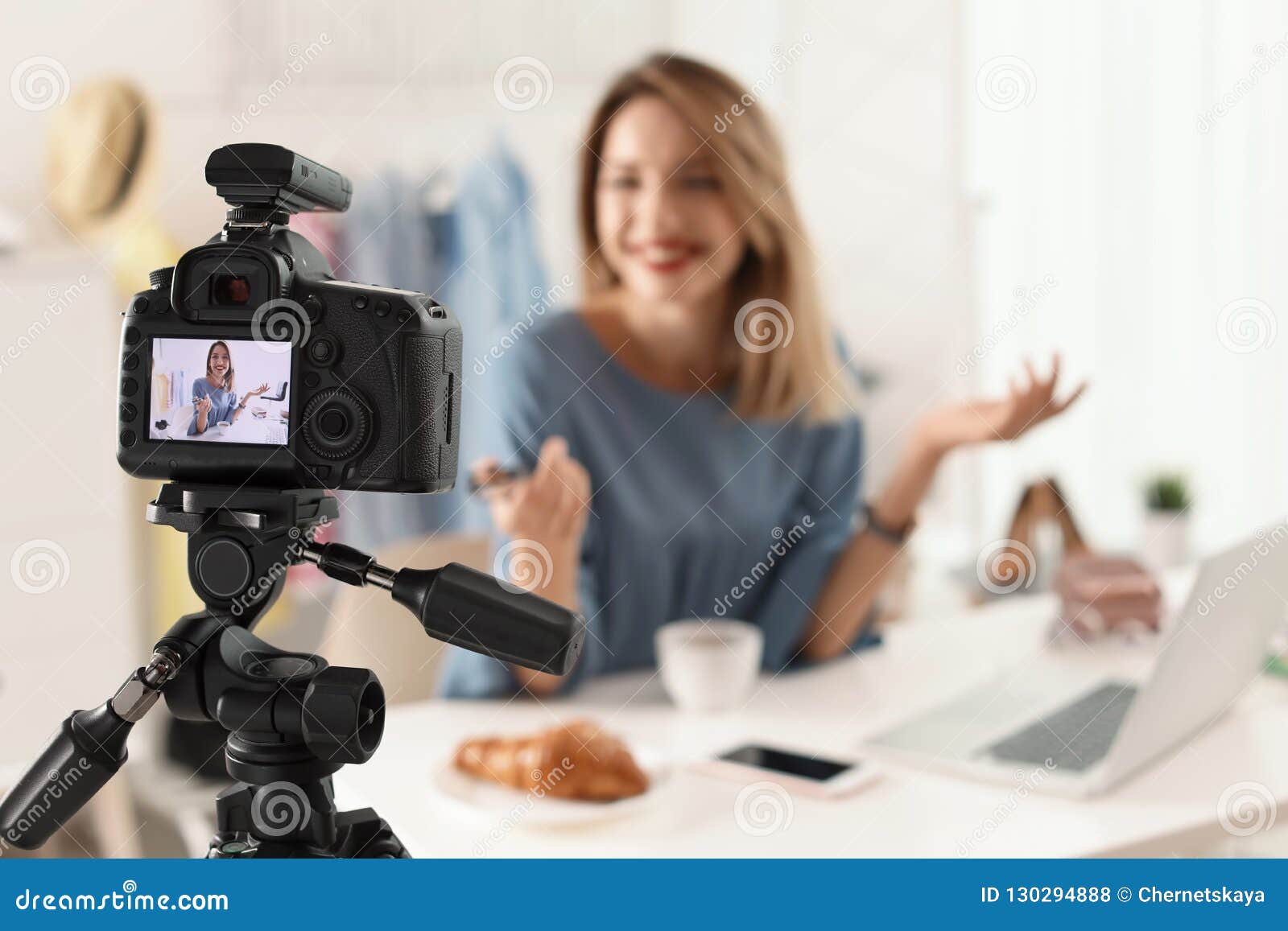 Fashion Blogger Recording Video Indoors, Focus on Camera Display Stock ...