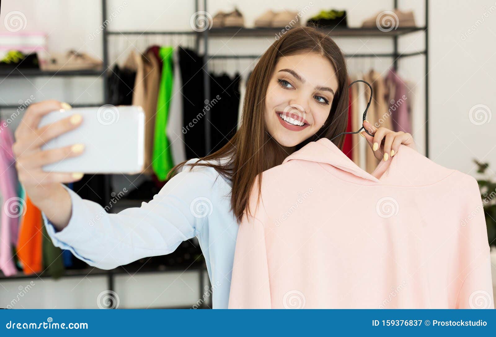 Fashion Blogger Taking Selfie while Shopping in Clothing Store Stock ...