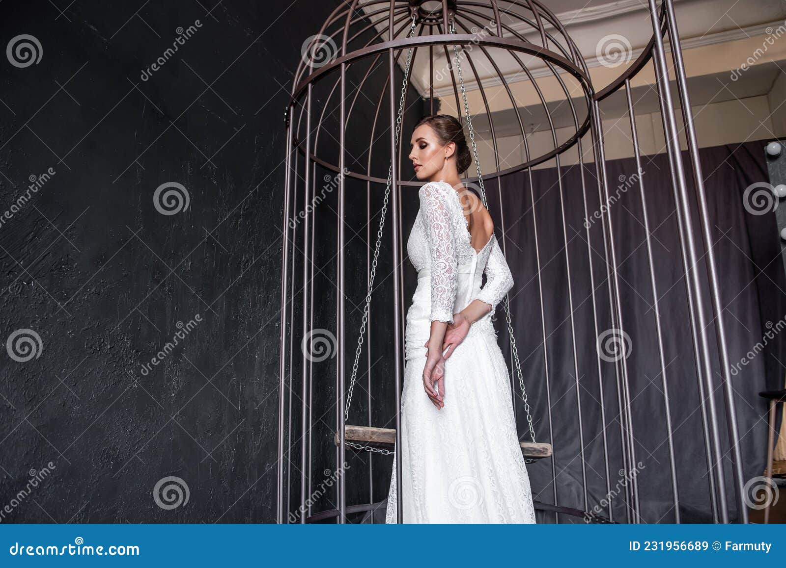 Fashion Bride In An Iron Cage Unhappily Looking Out From Behind Bars Life Out Of Will Stock