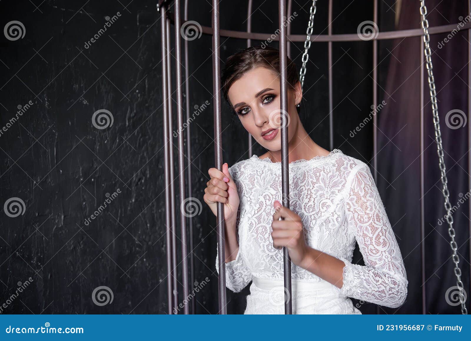 Fashion Bride In An Iron Cage Unhappily Looking Out From Behind Bars Life Out Of Will Stock