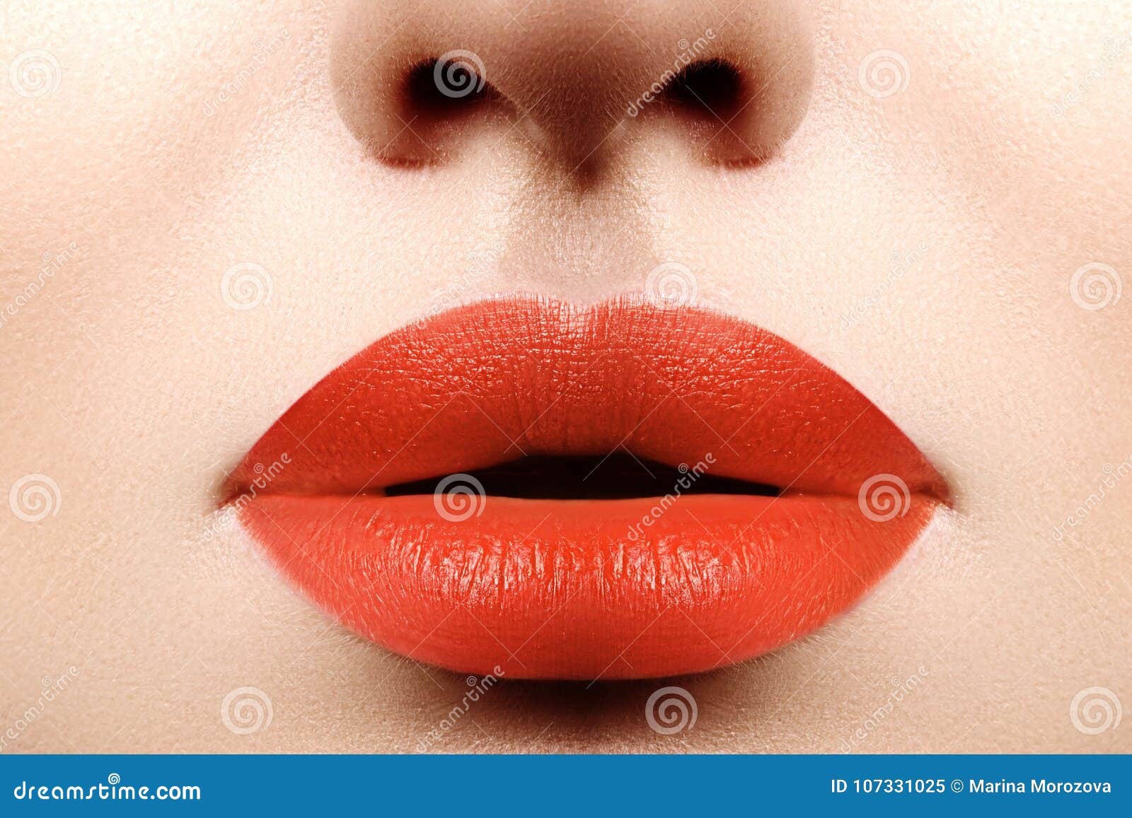 fashion bright makeup. macro of woman`s face. glamour lip make-up with orange lipstick. plastic surgery, filler