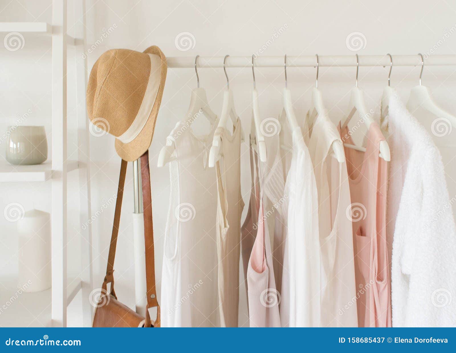 Fashion Clothes Concept. Female Blouses, T-shirts and Dresses on Hanger on  White Background Stock Image - Image of fashion, luxury: 158685437