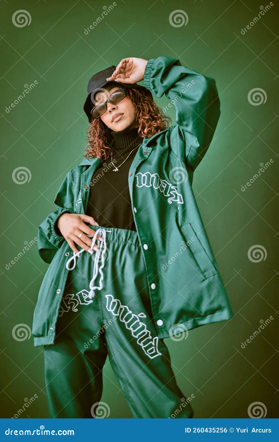 Fashion, wall and black woman with green clothes, fashionable style or cool hip  hop outfit. Fire