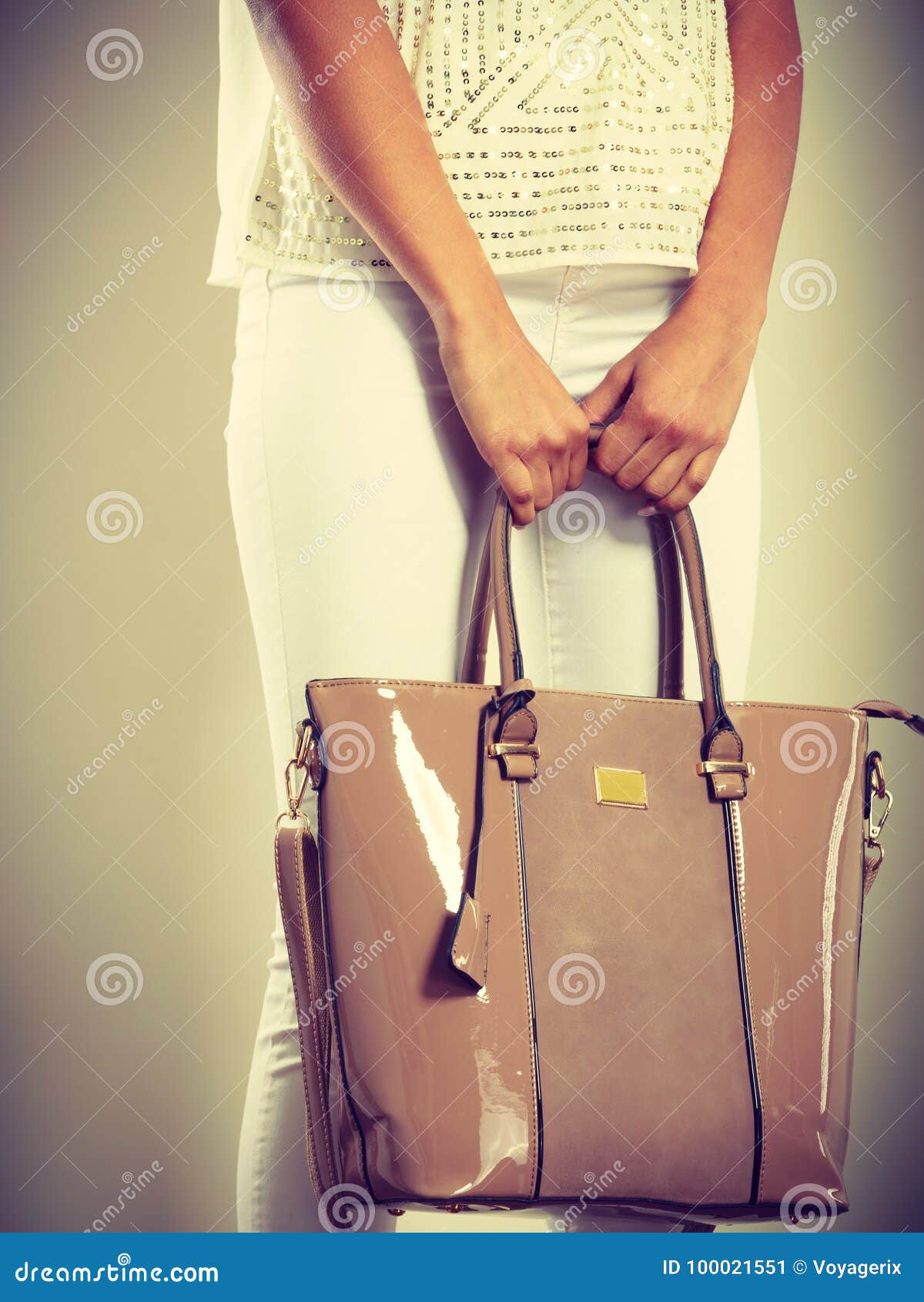 Woman Holding Beige Lacquered Leather Bag. Stock Image - Image of ...