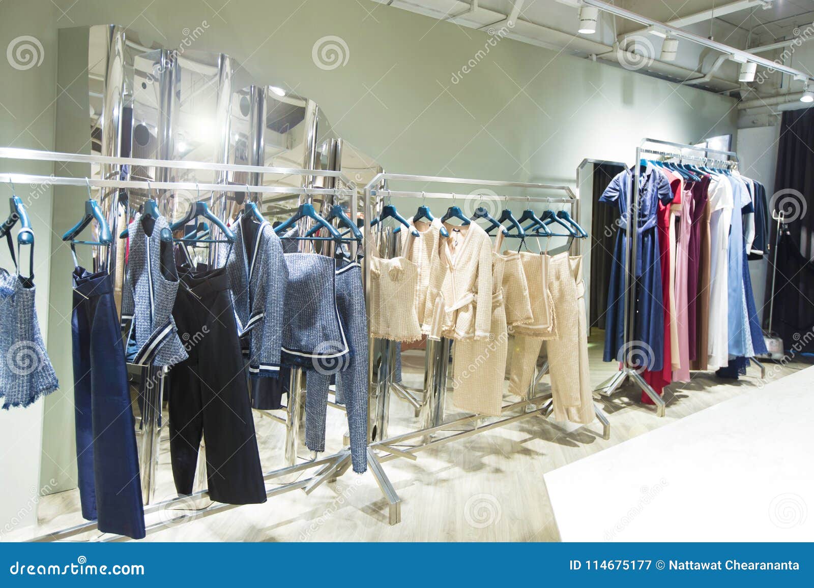 Fashion Design Clothes on Display Rack in Retail Shop Stock Image - Image  of famous, fashionable: 114675177