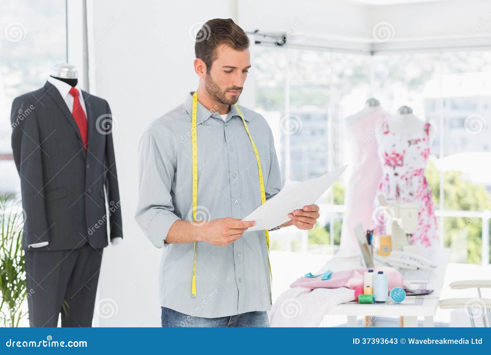 Fashion Designer Looking at Sketch in the Studio Stock Image - Image of ...