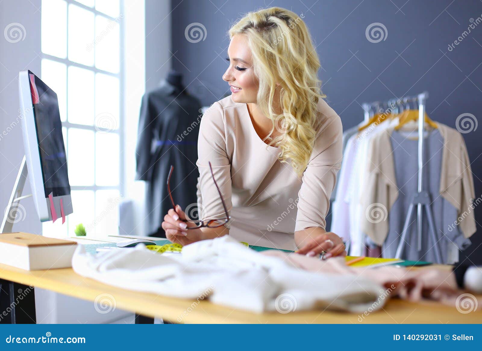 Fashion Designer Woman Working on Her Designs in the Studio. Stock ...