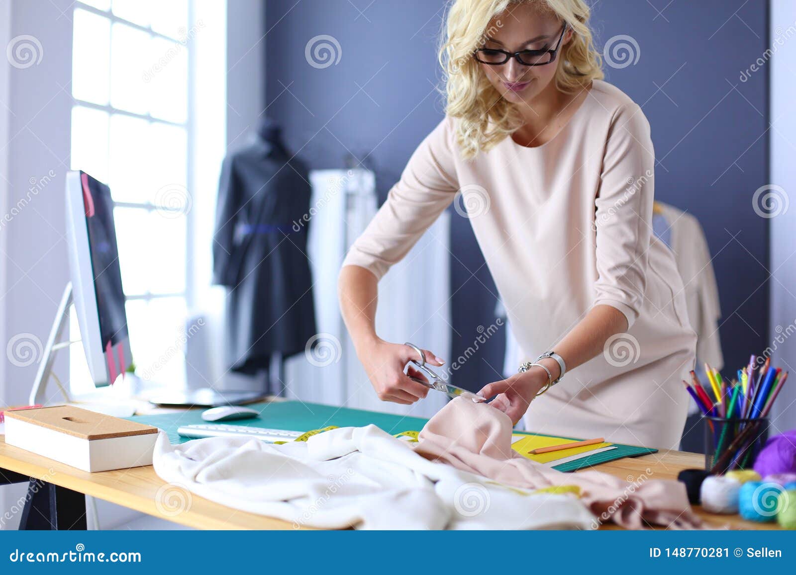 Fashion Designer Woman Working on Her Designs in the Studio. Stock ...