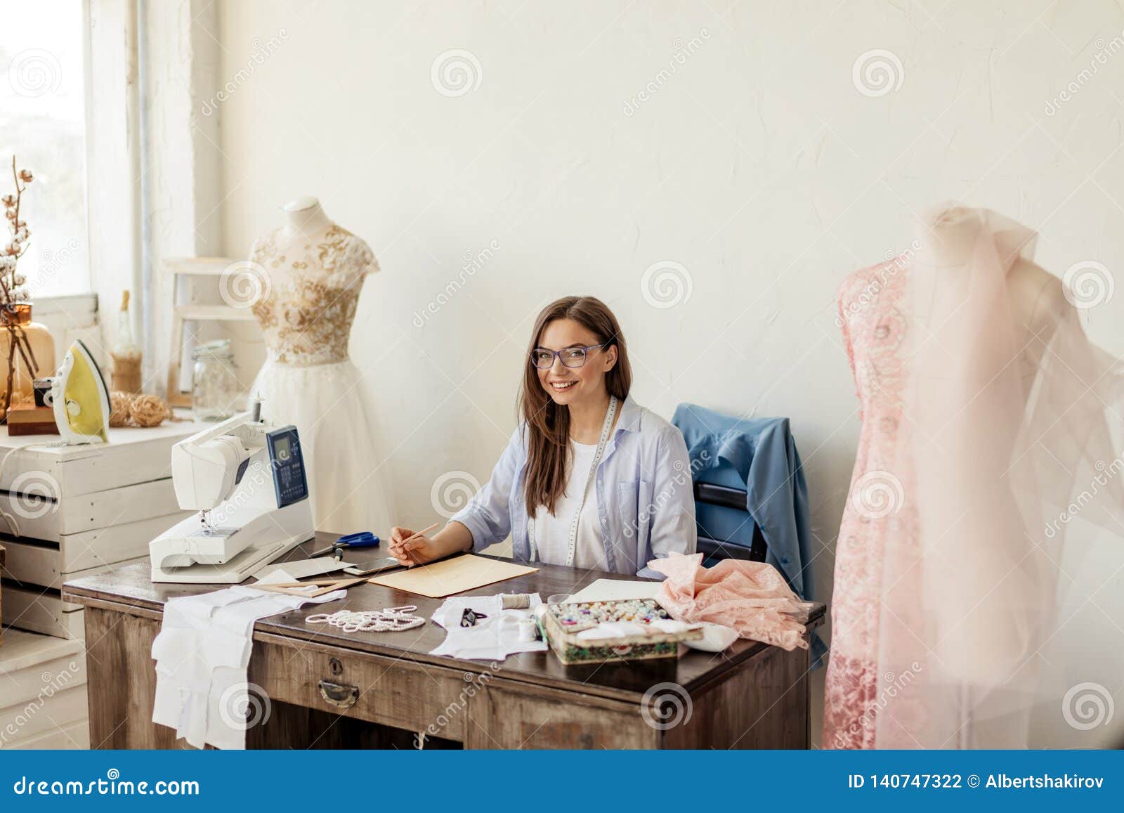 Fashion Designer at Work. Talanted Dressmaker Drawing Sketch at Her ...
