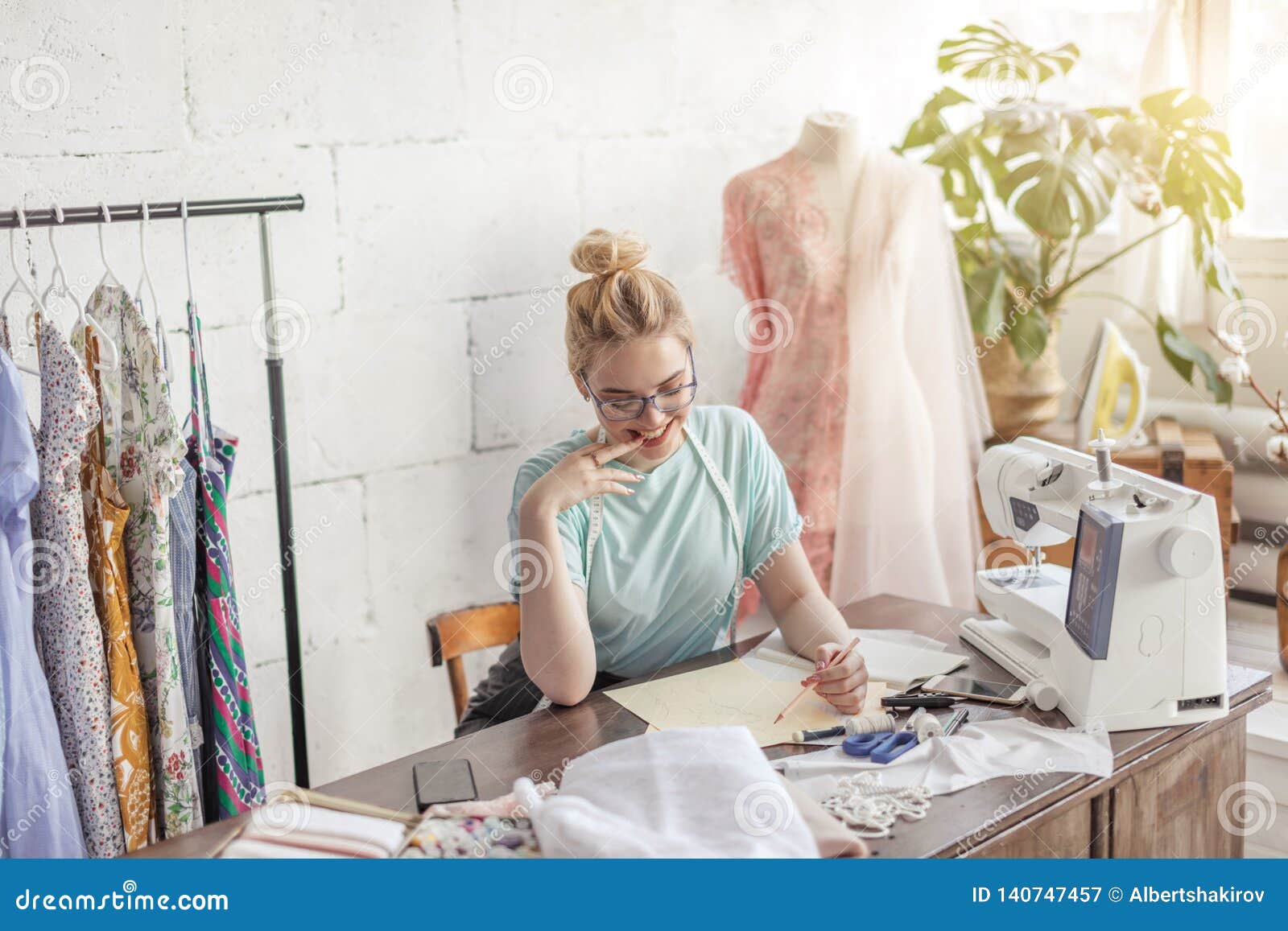 Fashion Designer at Work. Talanted Dressmaker Drawing Sketch at Her ...