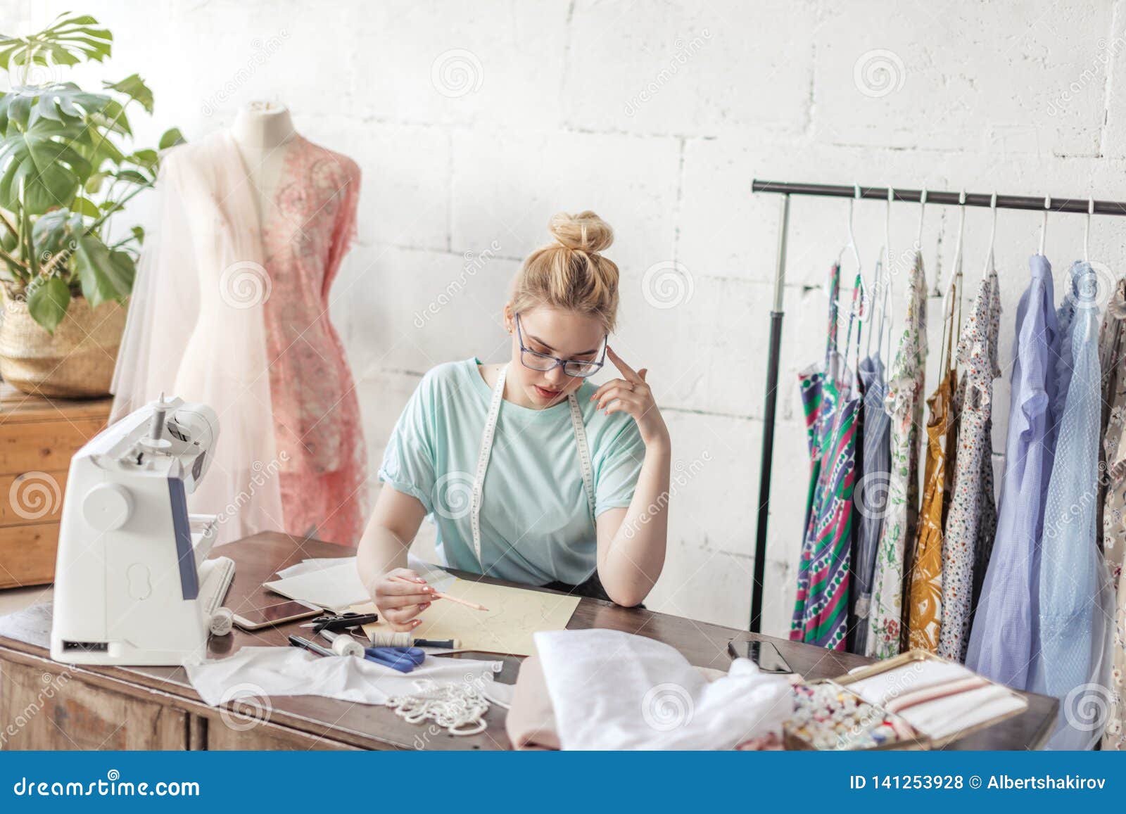 Fashion Designer at Work. Talanted Dressmaker Drawing Sketch at Her ...