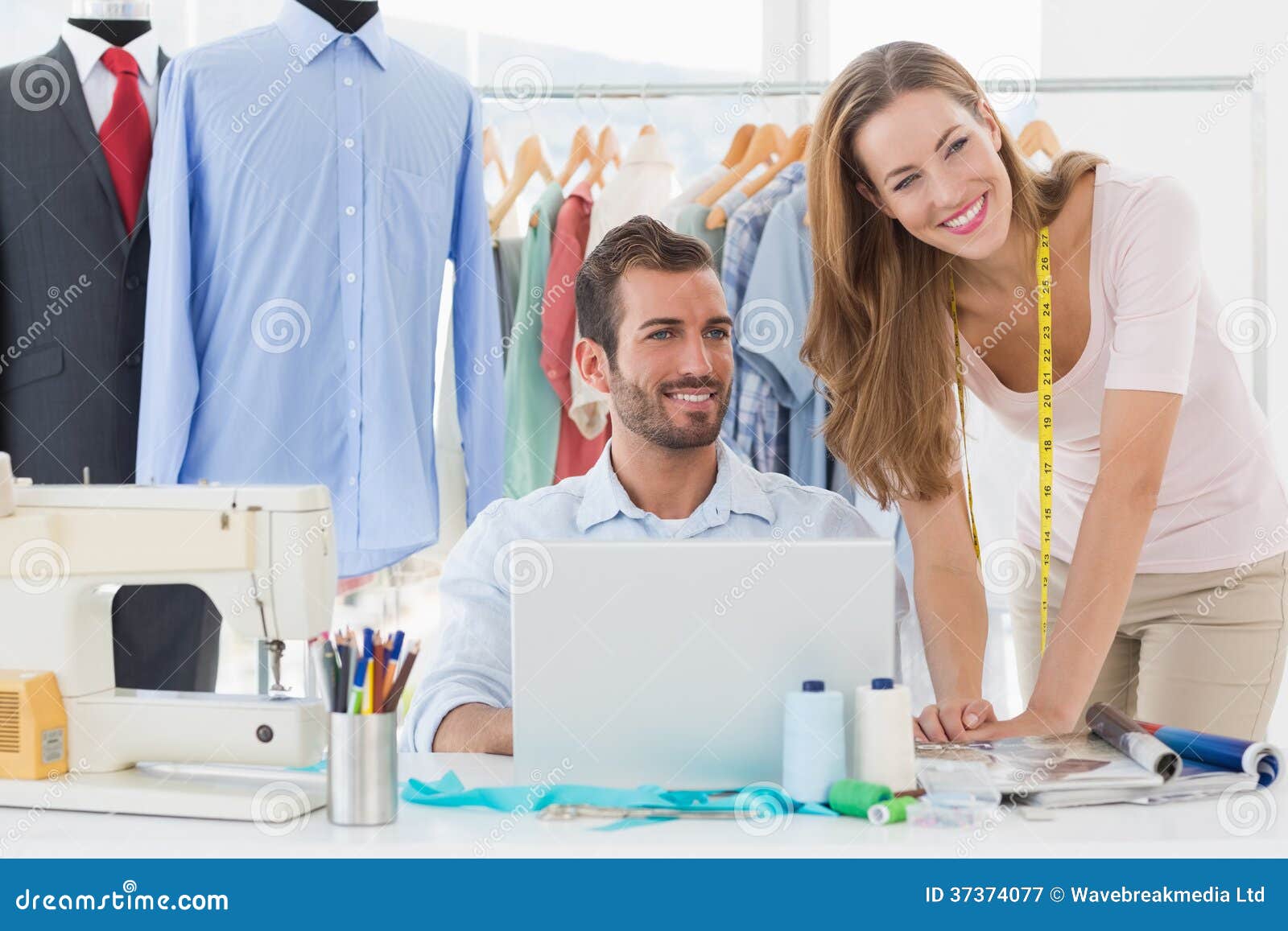 Fashion Designers Using Laptop in Studio Stock Image - Image of female ...