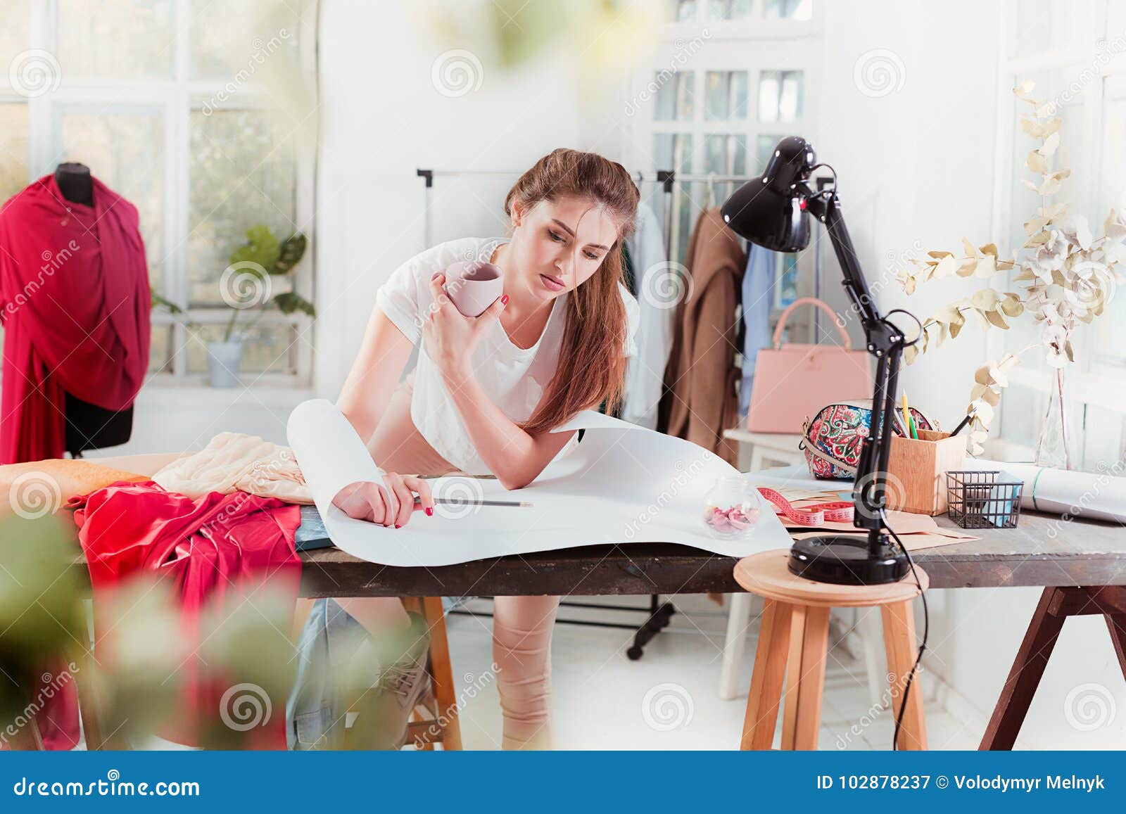 Fashion Designers Working in Studio Sitting on the Desk Stock Image ...