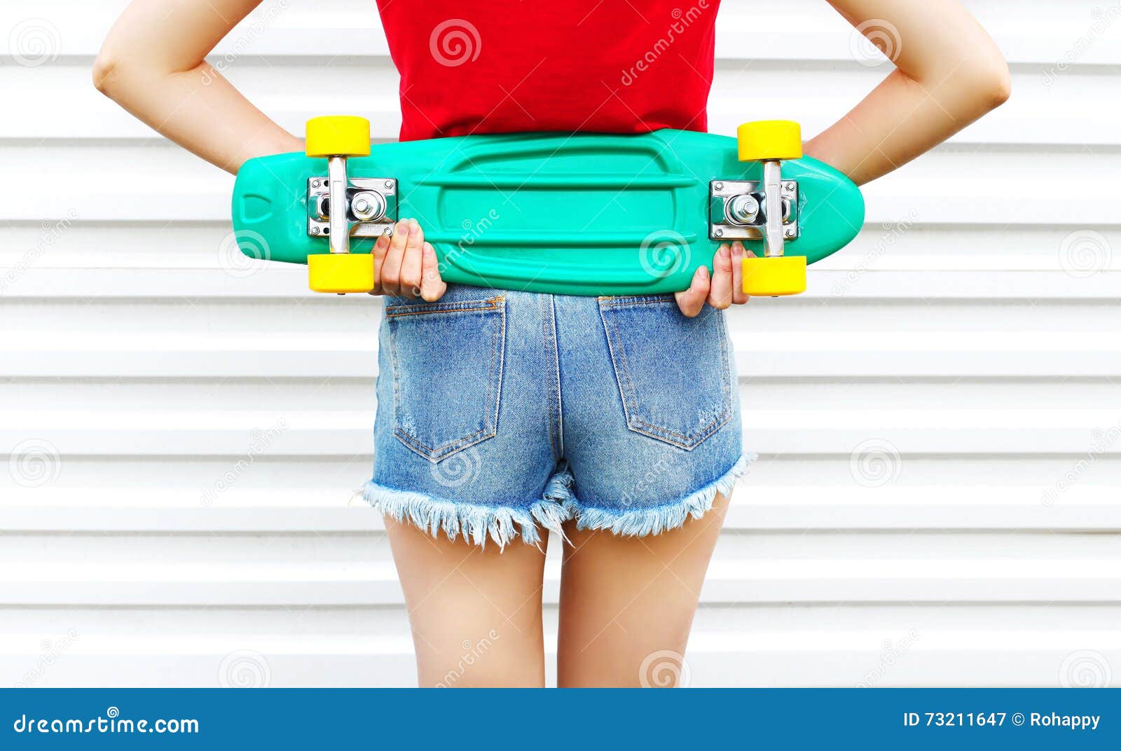 Fashion Girl with Skateboard in Denim Shorts Over White Background ...
