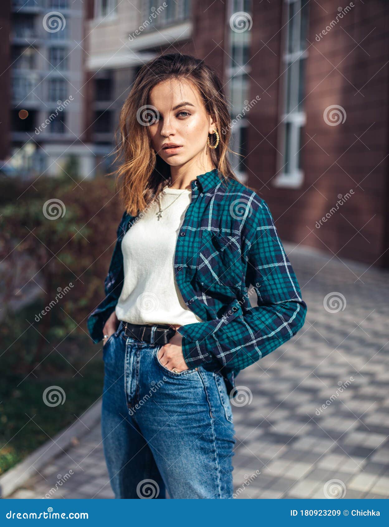 Fashion Hipster Woman Posing Outdoor. Plaid Shirt, Fashionable High-waisted  Jeans,brunette Hair Stock Image - Image of hair, hipster: 180923209