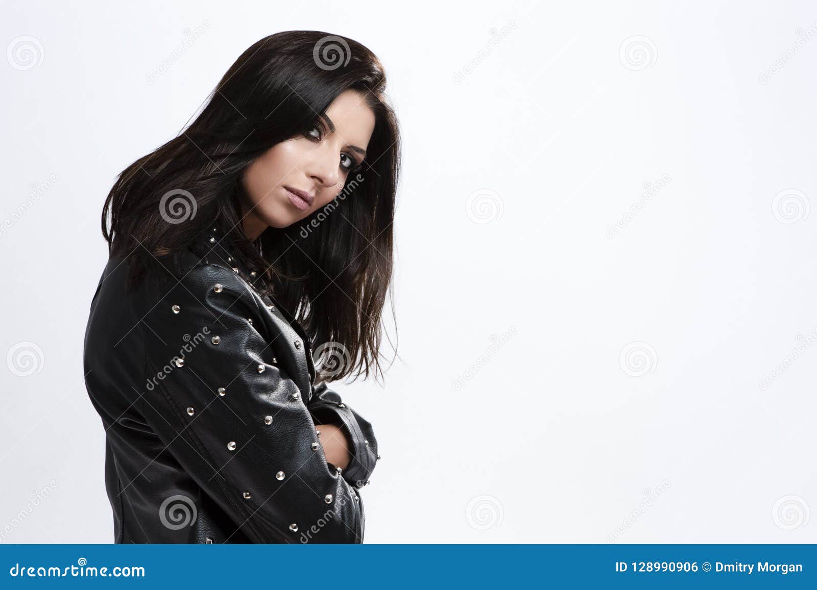 Portrait Of Smiling Caucasian Brunette Girl In Rough Leather Jacket