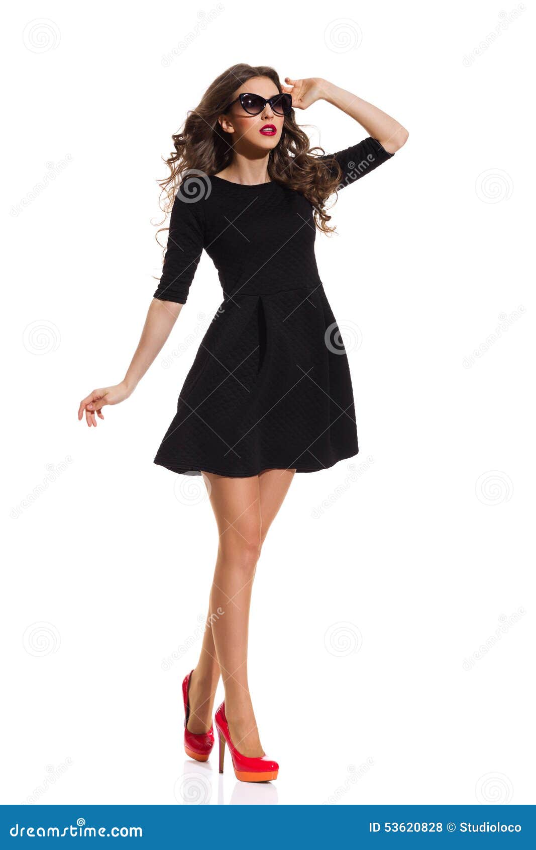Fashion Model In Black Mini Dress And Red High Heels Stock