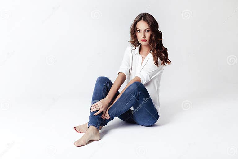 Fashion Model in a Blouse and Jeans Barefoot Stock Photo - Image of ...