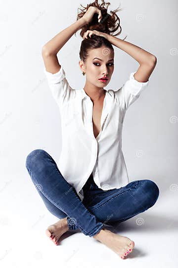 Fashion Model in a Blouse and Jeans Barefoot Stock Image - Image of ...