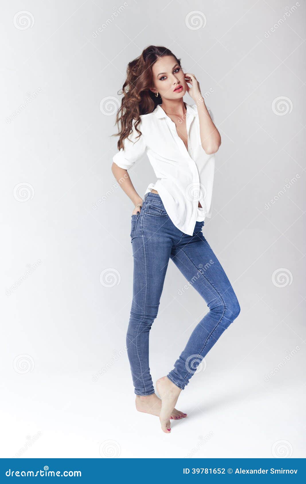 Fashion Model In A Blouse And Jeans Barefoot Stock 