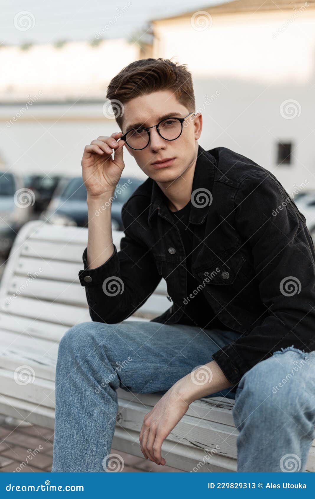 Fashion Model Cool Young Man in Stylish Jeans Clothes Straightens ...